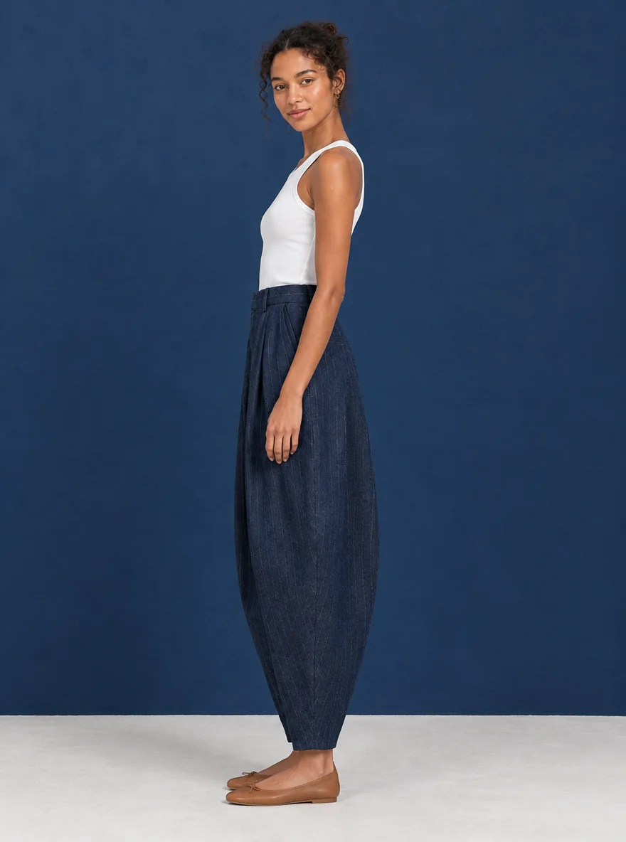 Pinstripe Arc Trouser, worn, side profile showing the arc